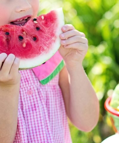watermelon summer little girl eating watermelon food 35545 Young girl eating a juicy watermelon slice in a sunny outdoor setting, symbolizing summer refreshment.
